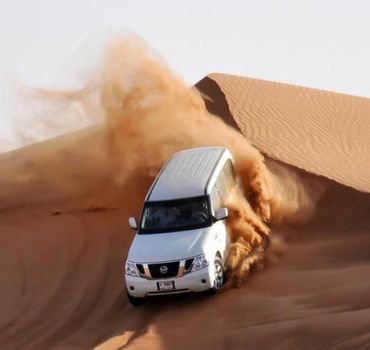 Red Dunes Desert Safari with Camel Ride, Sand Boarding, BBQ Dinner &amp; Entertainment