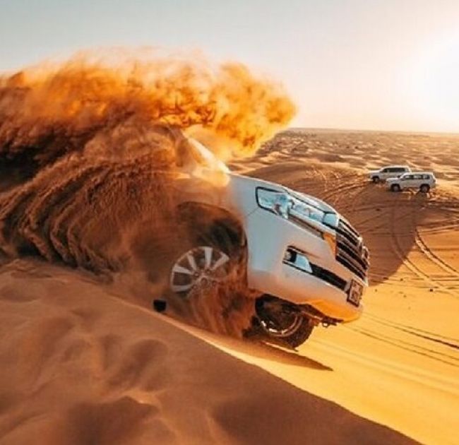 Red Dunes Desert Safari with Camel Ride, Sand Boarding, BBQ Dinner & Entertainment